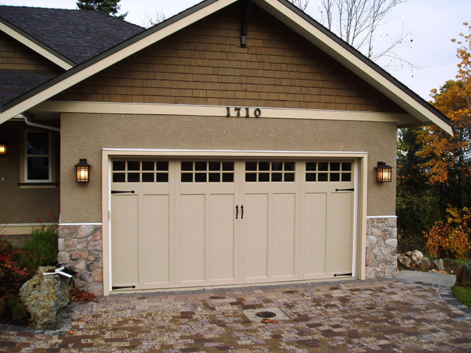 Coachman carriage house garage door with windows