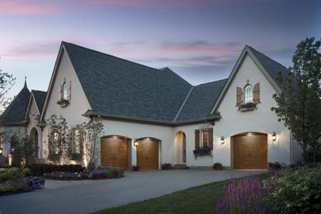 Clopay Gallery Collection steel garage doors with medium oak ultra-grain paint finish.