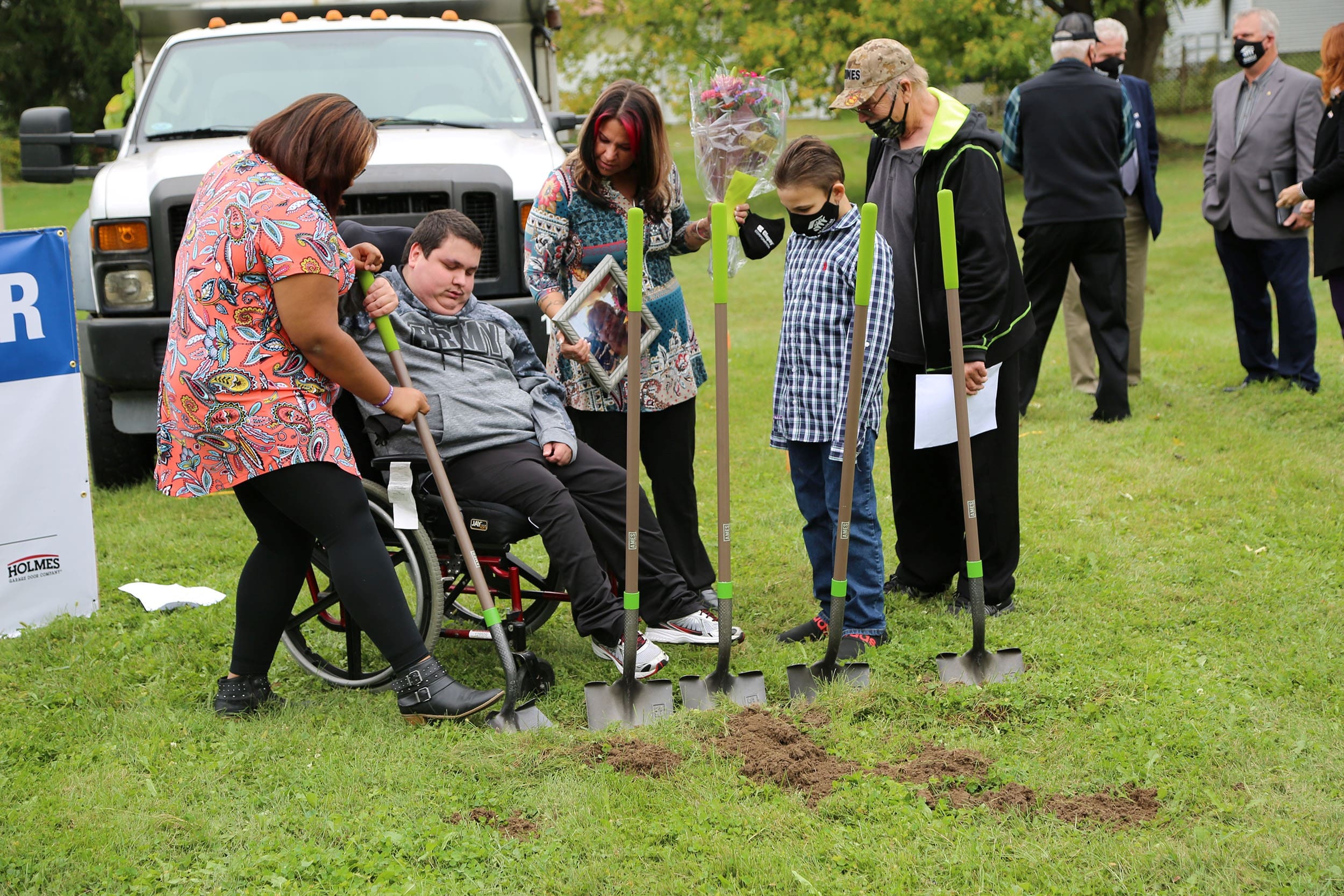 Family Digging with Shovels